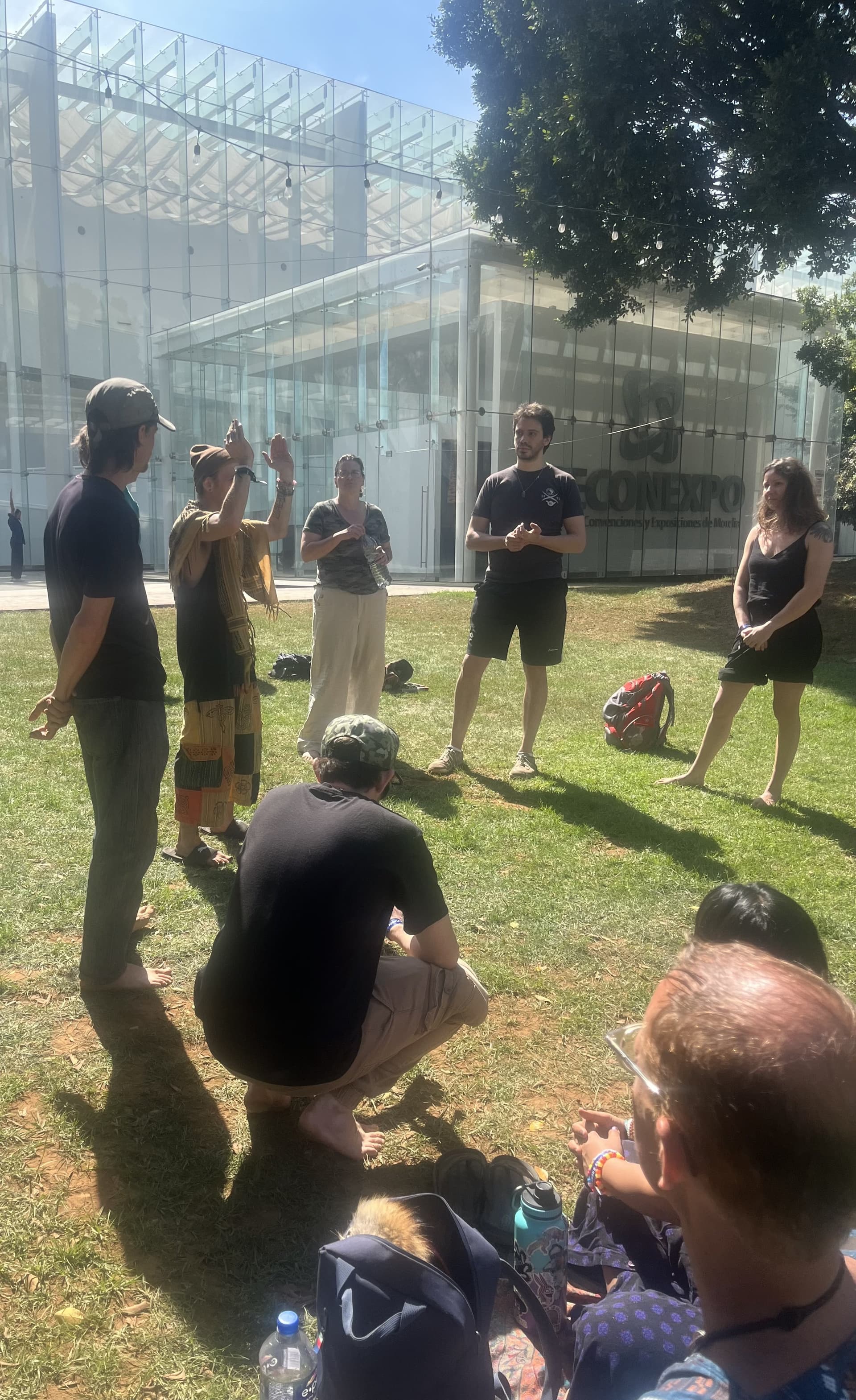 Participants in an outdoor group exercise practicing communication skills